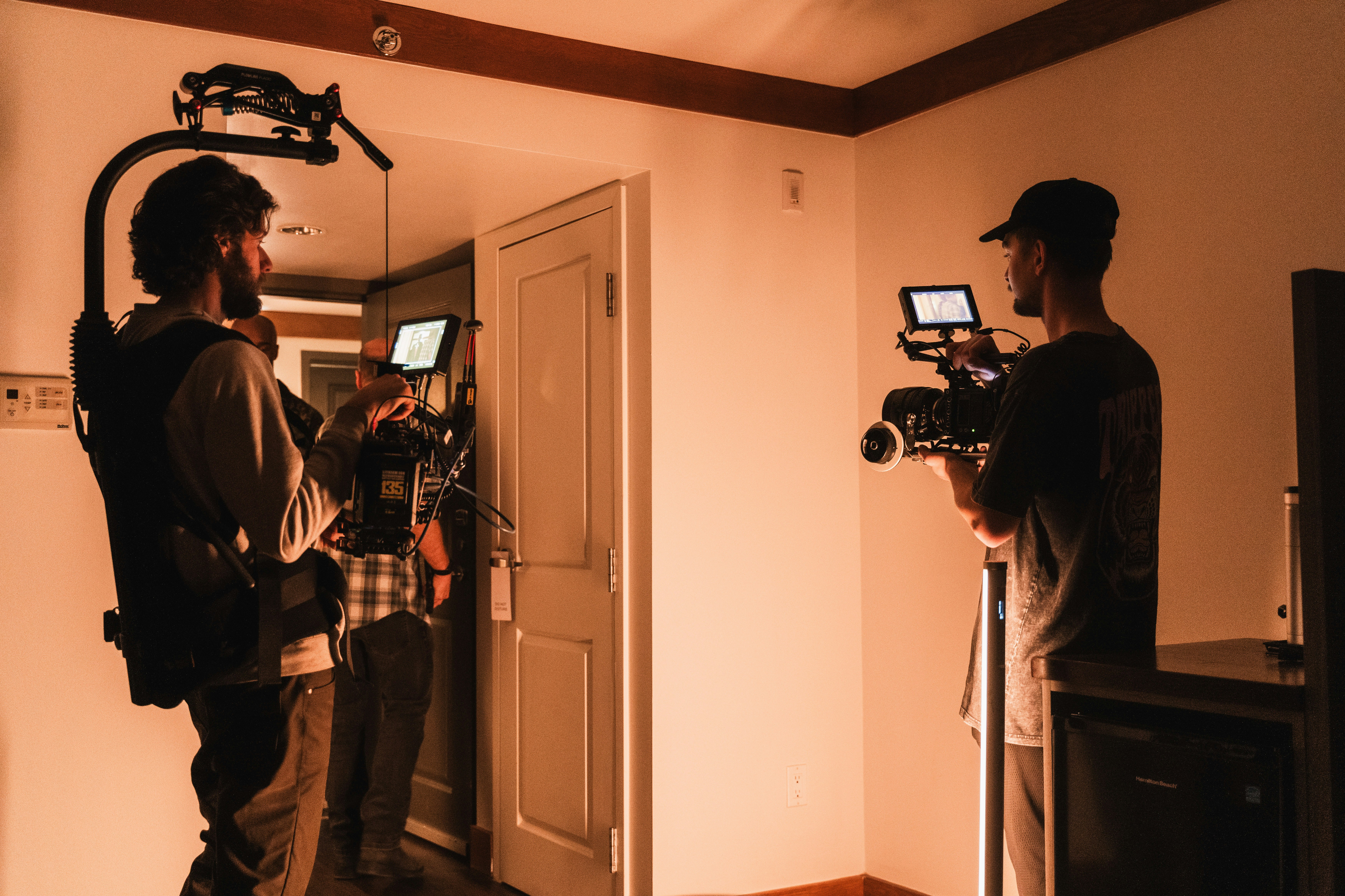 Film crew framing a historic interior